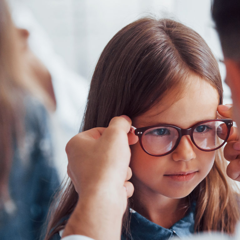 Child happily wearing Stellest myopia control lenses